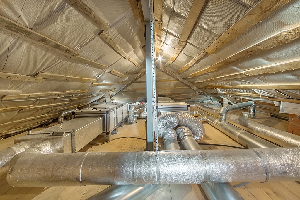 Insulated round ducts and flexible ductwork running through a foil-lined attic