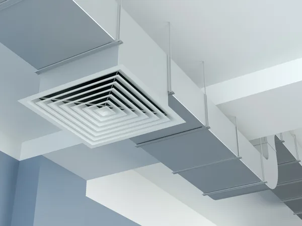 Square ceiling air diffuser on white rectangular ductwork suspended from a ceiling