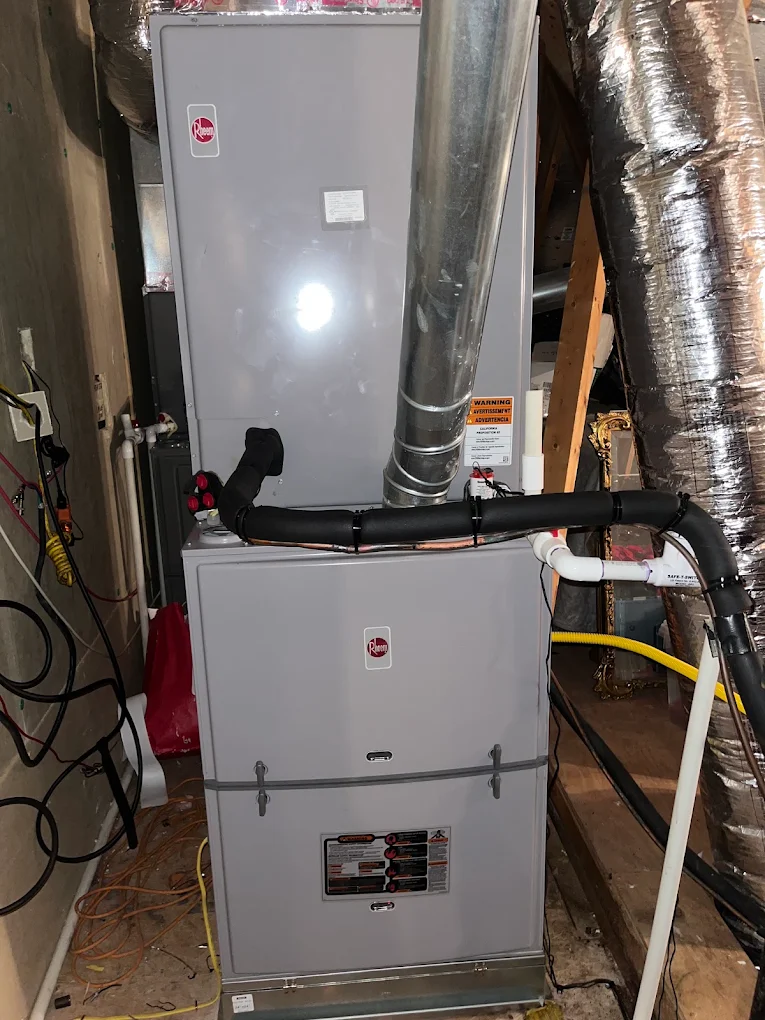 Rheem gas furnace with flue pipe and ductwork installed in an attic space in West Monroe, LA
